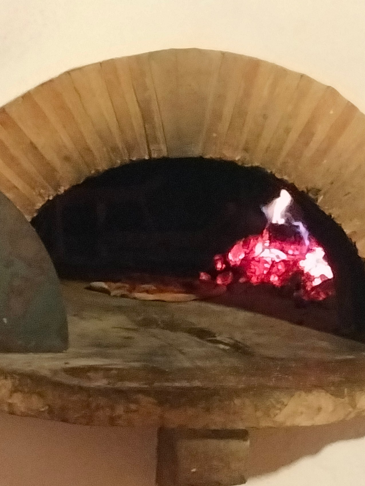 Baking a pizza in the brick pizza oven