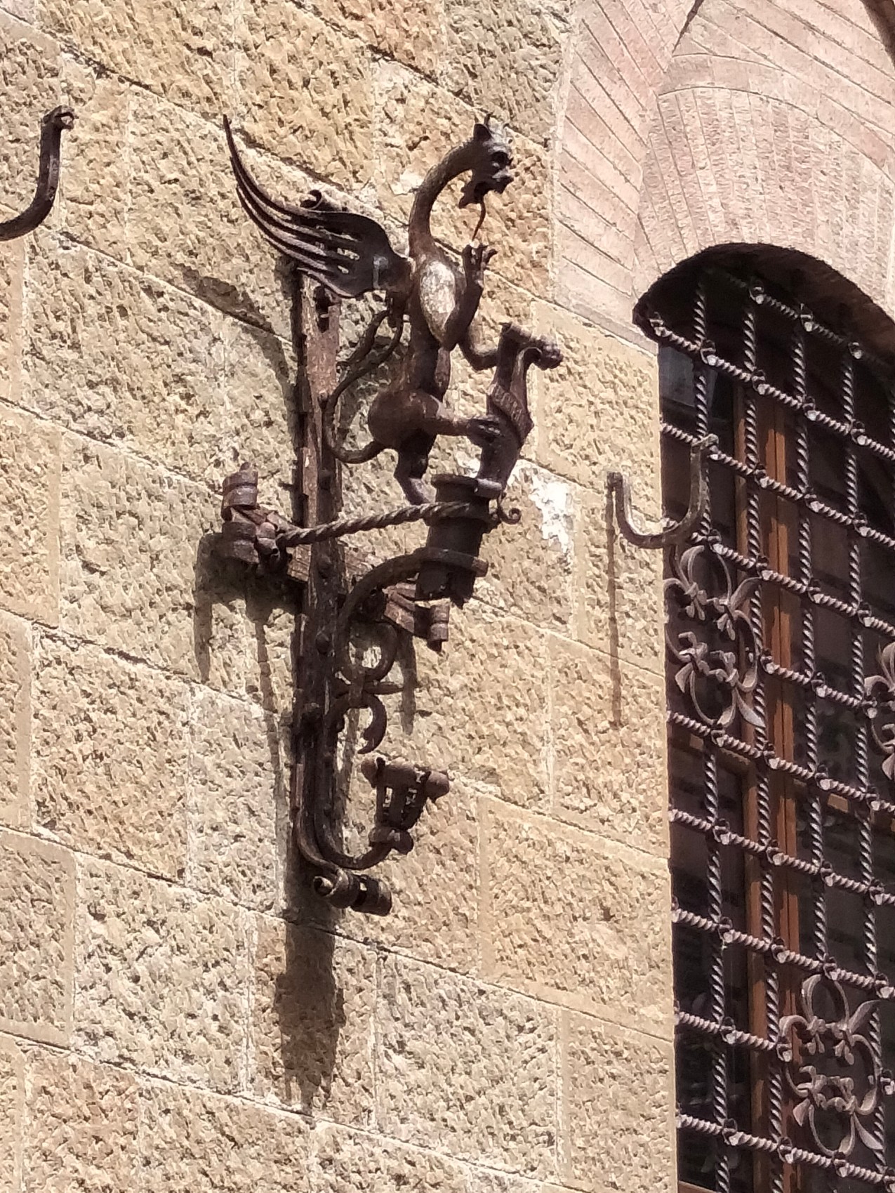 An iron dragon sconce