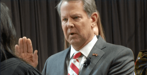 How can we explain Kemp's sudden change of heart and support for Trump?