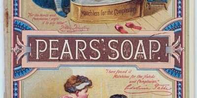 A 19th century style advertisement in two panels. The upper panel shows a black child in a bathtub and a white child giving them a bar of Pear's Soap to bathe with. The lower panel shows the black child out of the bath but with a white body and black face. The caption reads, "Pear's Soap is good for the complexion."